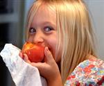 Girl Eating Peach.jpg 